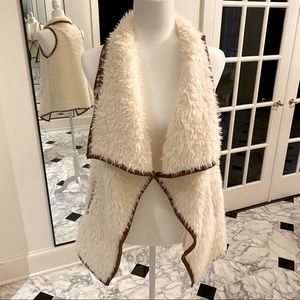 Shearling vest with brown faux leather piping